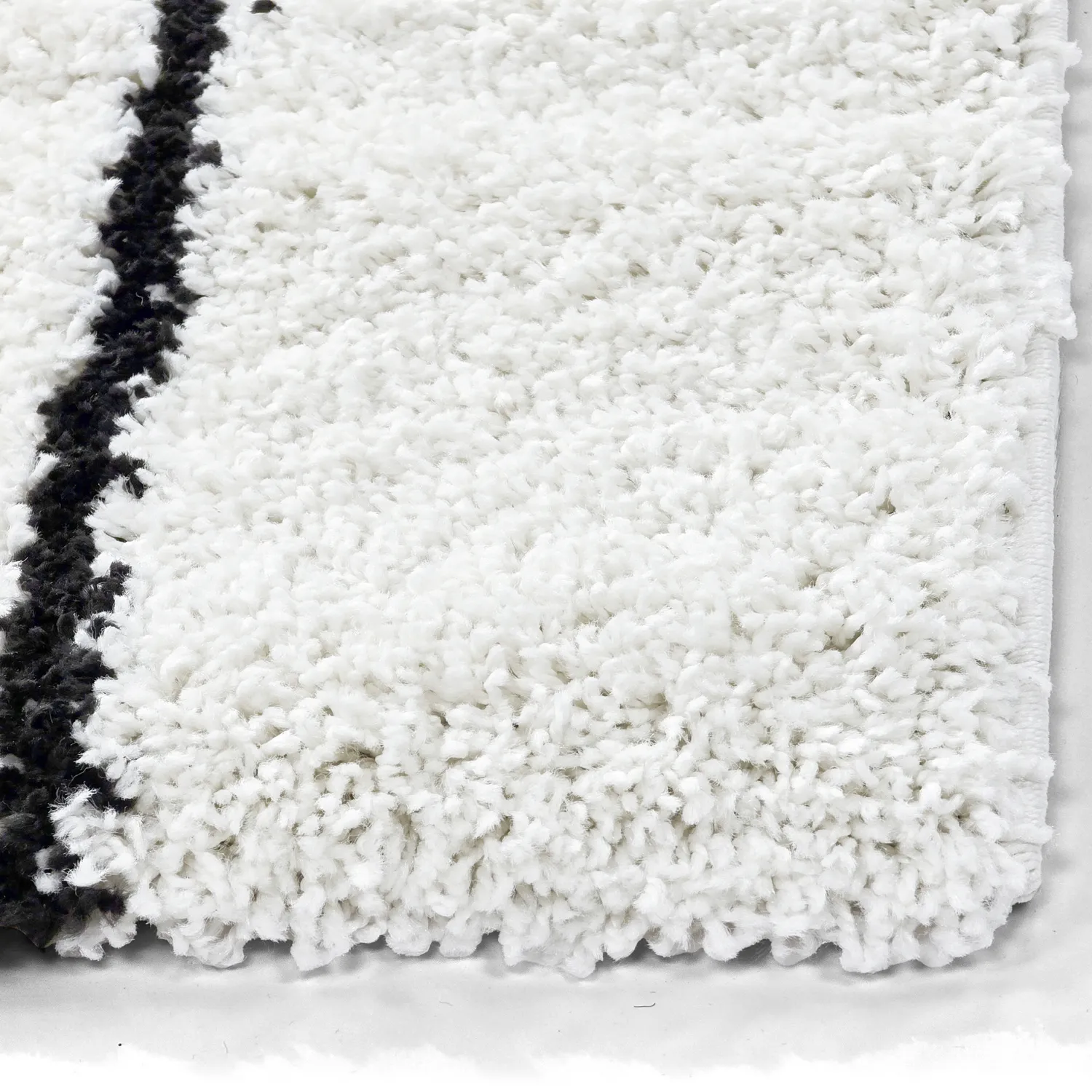 Ryatæpper - Eze (hvid/sort)